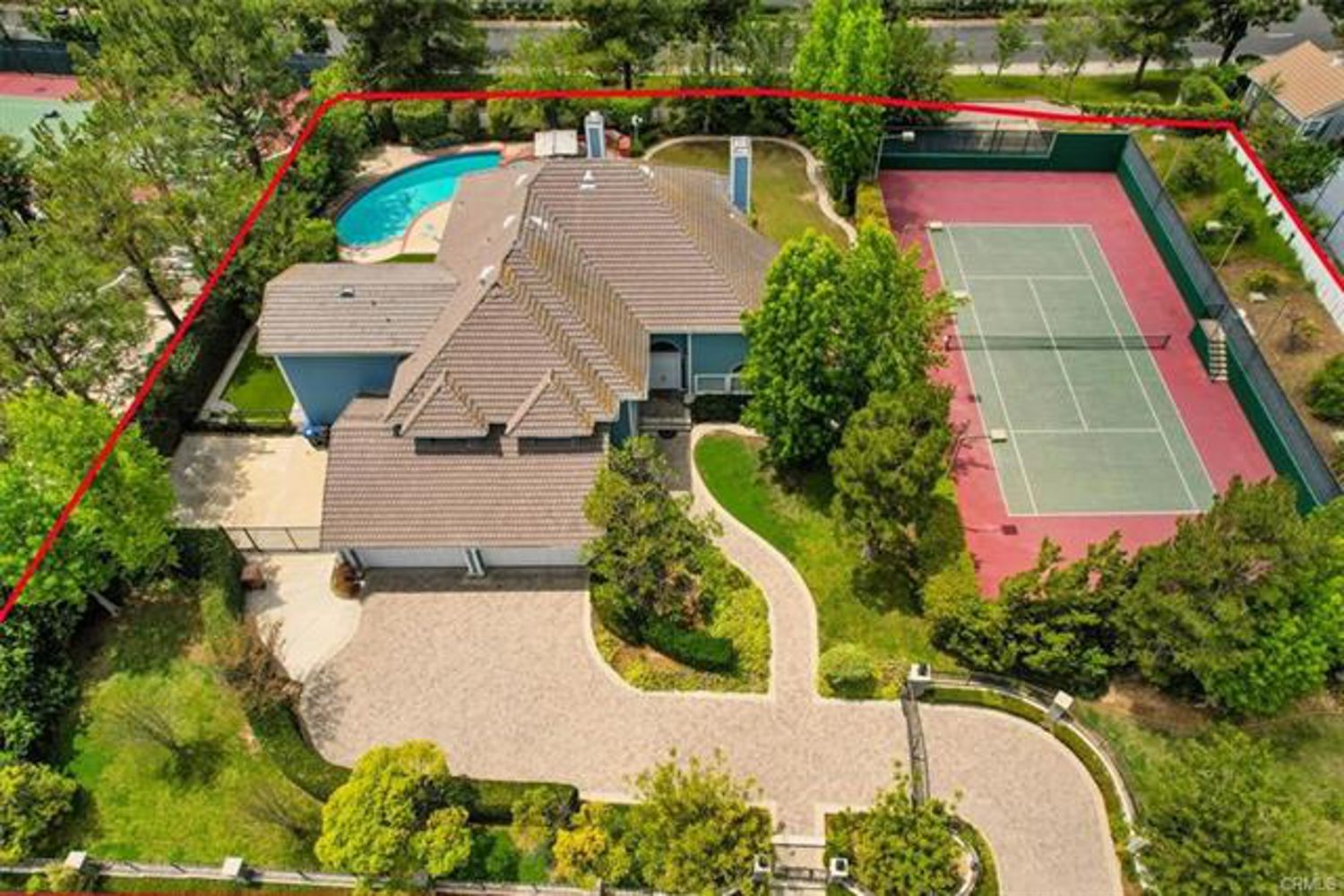 Aerial view of the full one-acre estate
